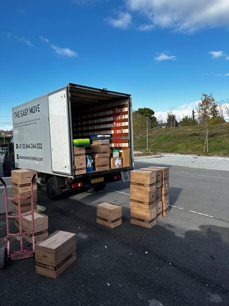 Moving van with boxes outside for an organized move with a digital moving checklist to tick off pdf
